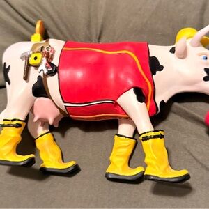 Cow Figurine with Red and Yellow Accents Construction worker